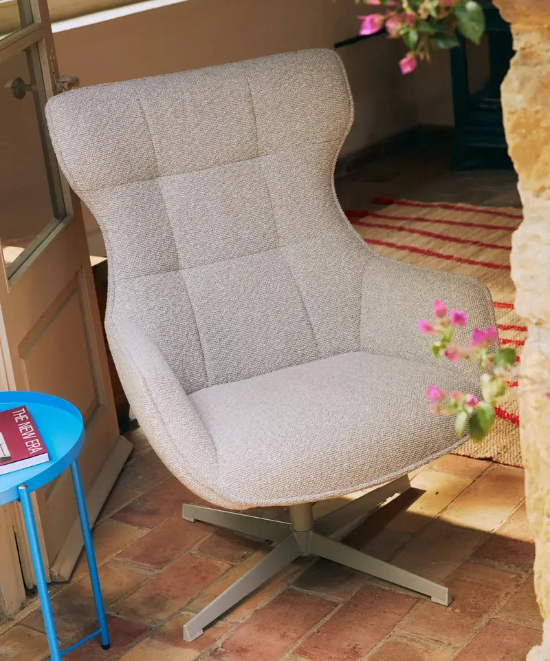 Sillón tapizado en tela bouclé Elsa